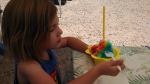 S eating her Hawaiian shaved ice